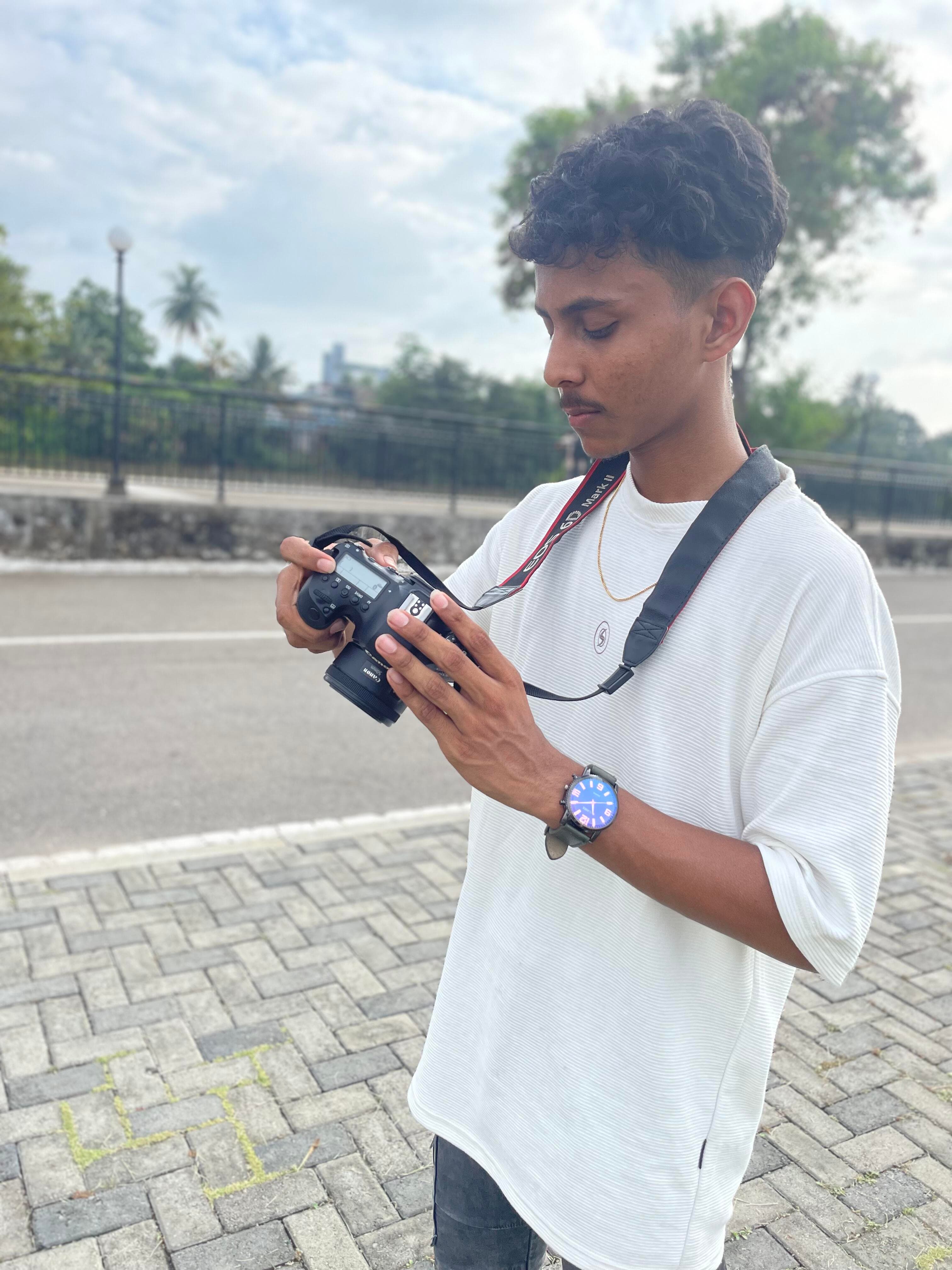 Vimukthi Indunil looking at a camera outdoors